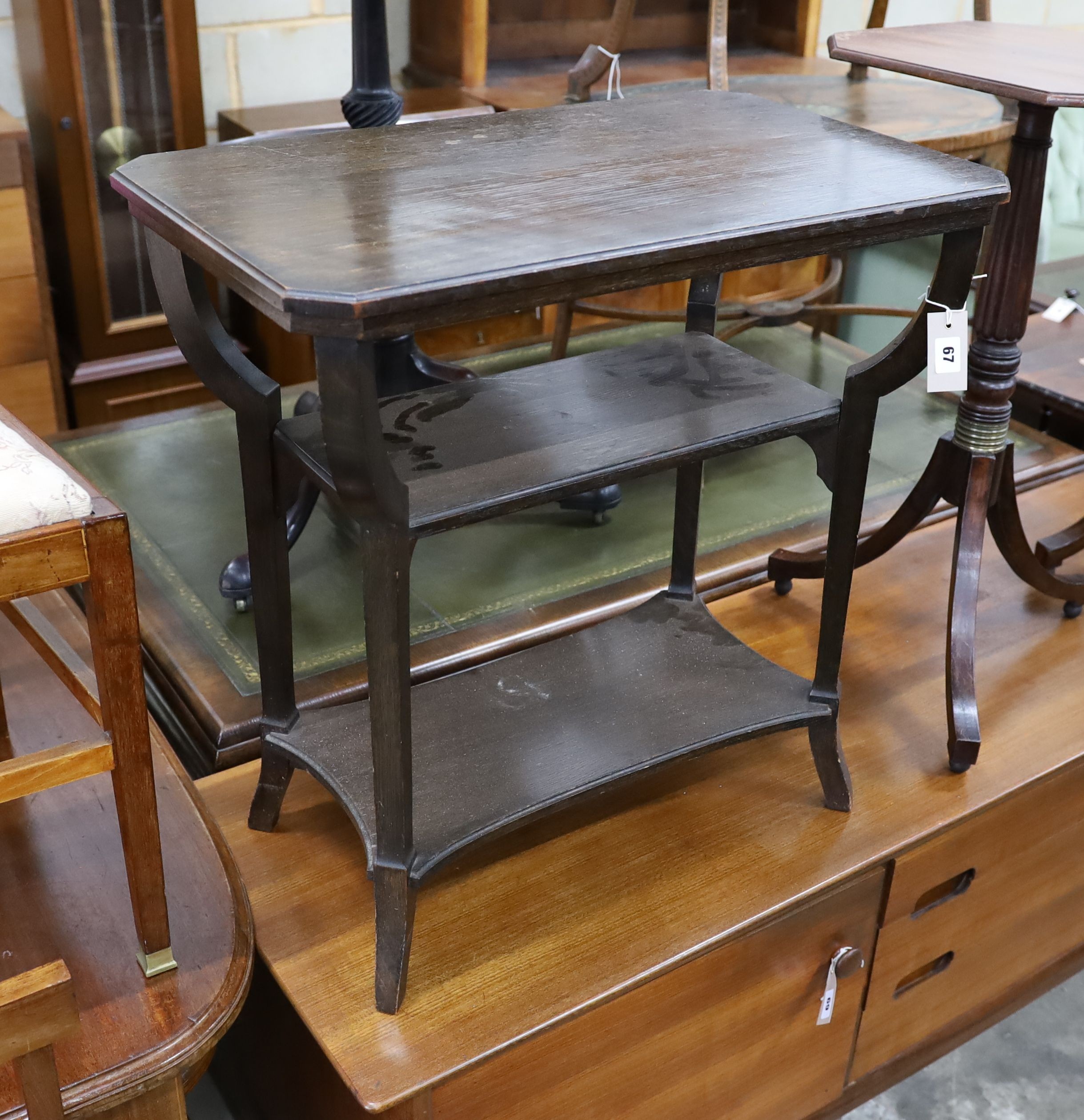 A Liberty's three tier rectangular oak occasional table, width 67cm, depth 42cm, height 69cm